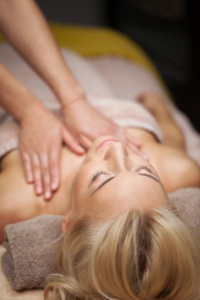 beautiful young woman enjoys massage