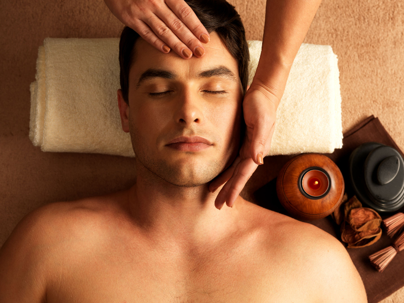 man receiving a head massage